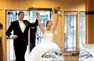 Wedding couple entering the room being announced while high energy music is played energizing the guests